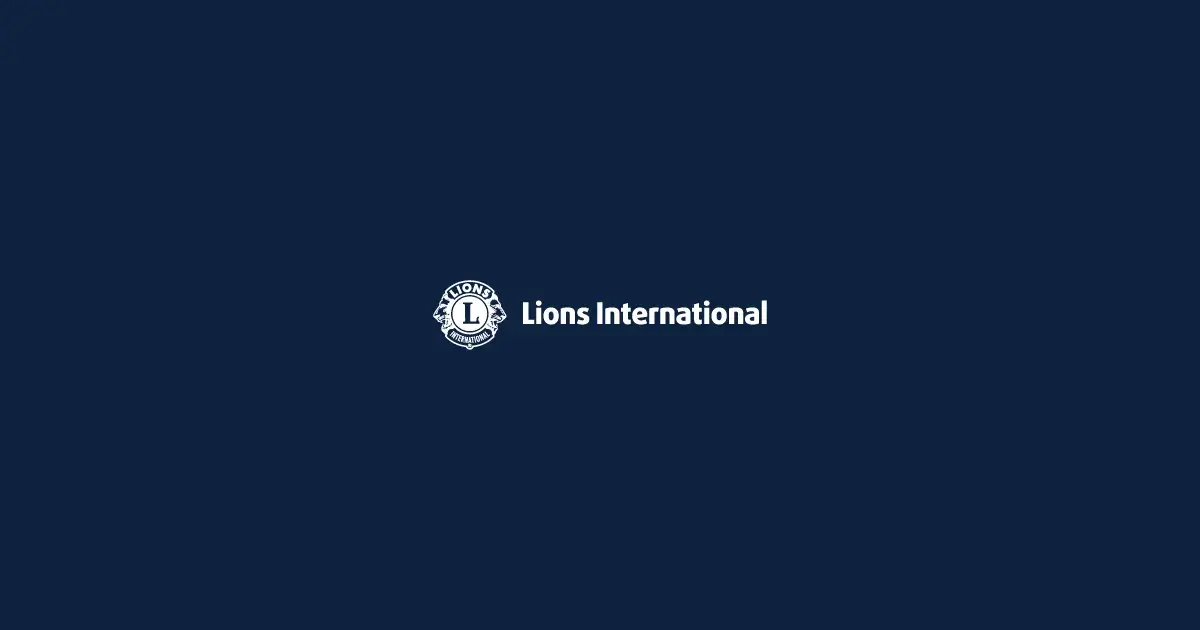 Hero: Lions International signature on navy The Lions International signature — the circular Lions emblem beside the words "Lions International" — reproduced in white on a navy blue field.